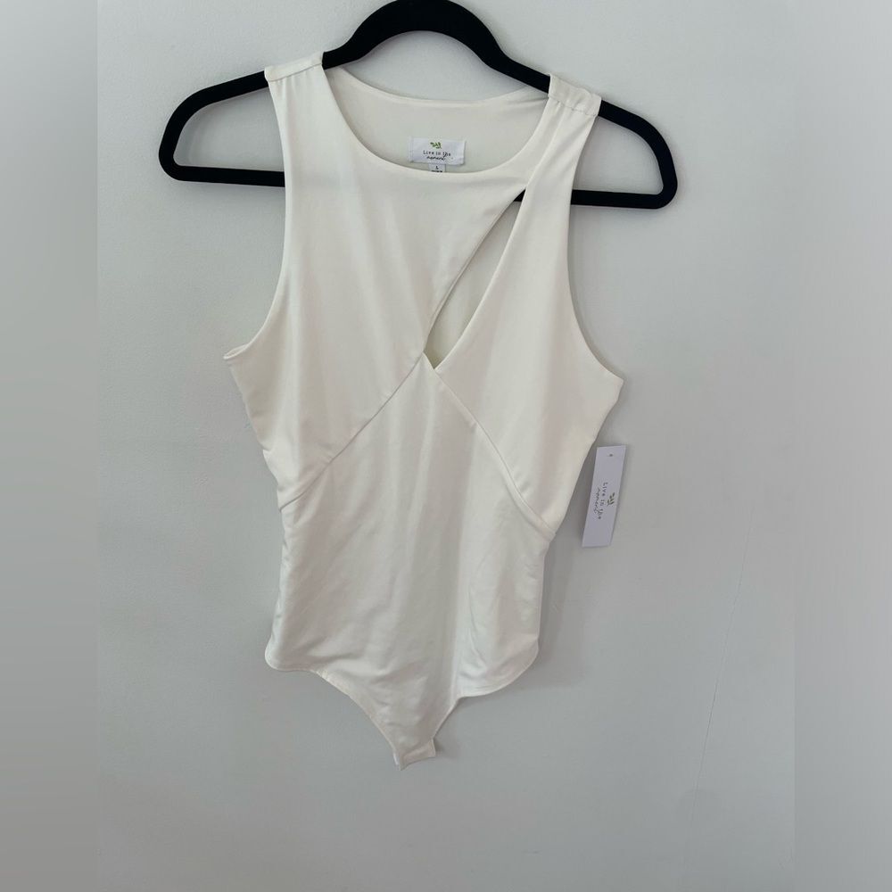 NWT Live in the moment White Body Suit size large with small cut out